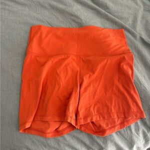 Aritzia athletic shorts. BUTTER Atmosphere Hi-Rise 5" Short. Orange. Size XL.
